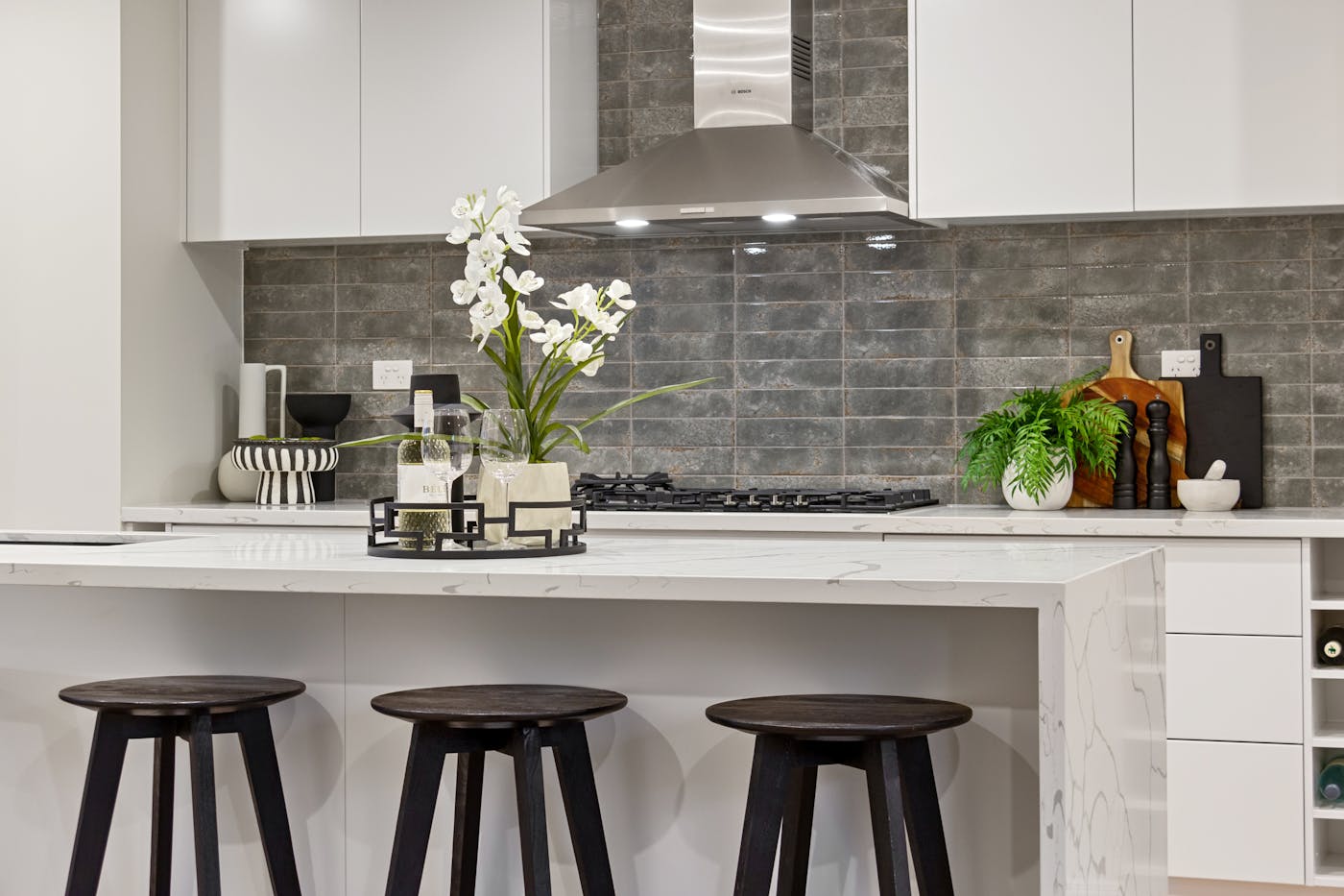 Modern kitchen cabinetry with island seating